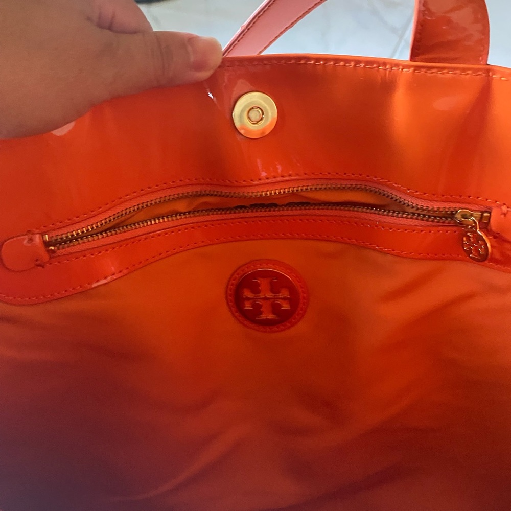 Tory Burch vinyl tote sold as is with marks and discoloration.